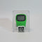A green digital step counter inside a clear plastic clamshell package with a black and white MABROUK label, held by a hand against a blurred indoor background.